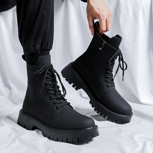 Black high-top mid-calf Martin boots with a thick bottom for comfort.