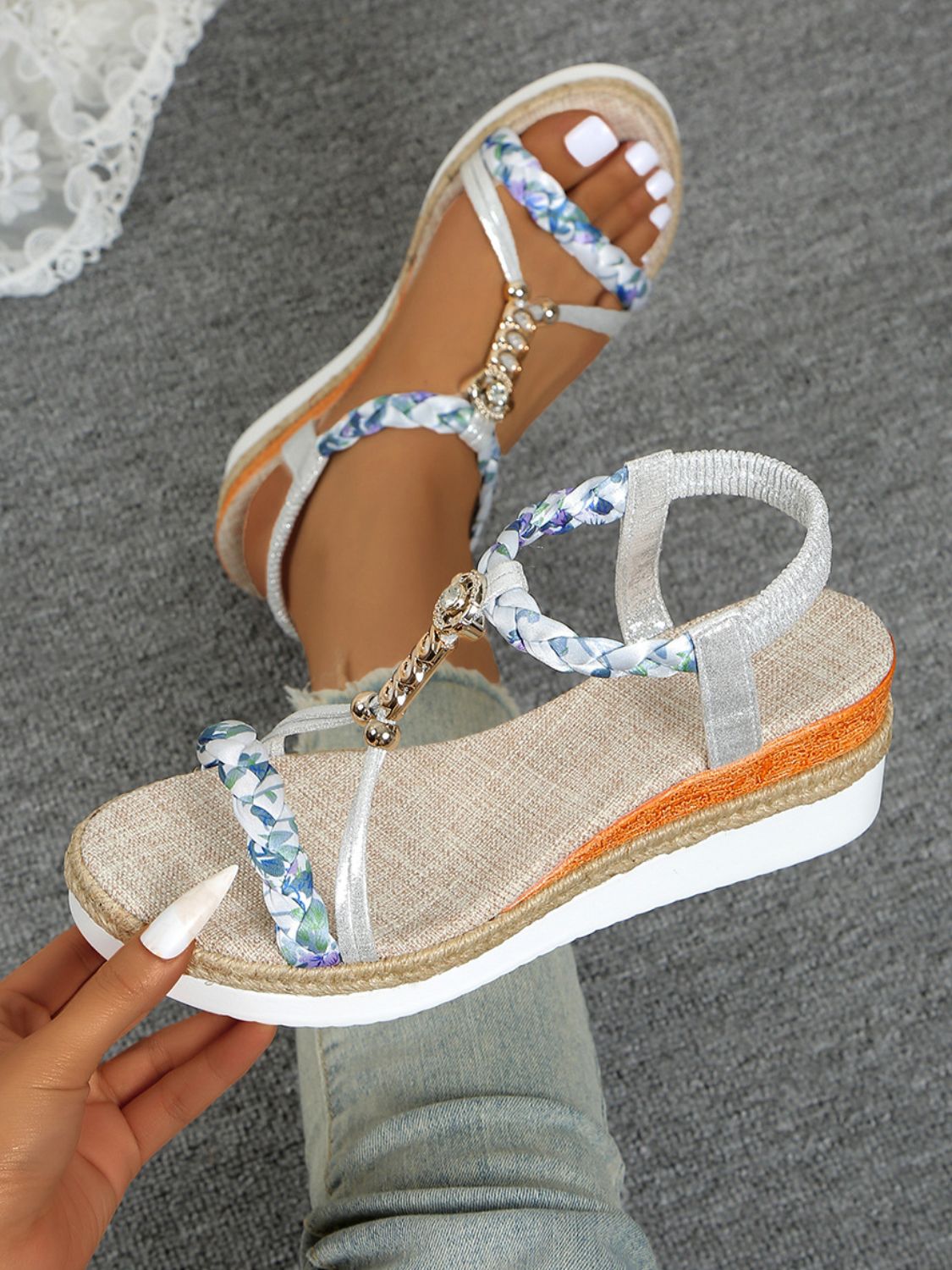 Pair of Contrast Woven Wedge Sandals on the floor, perfect for casual or semi-formal occasions