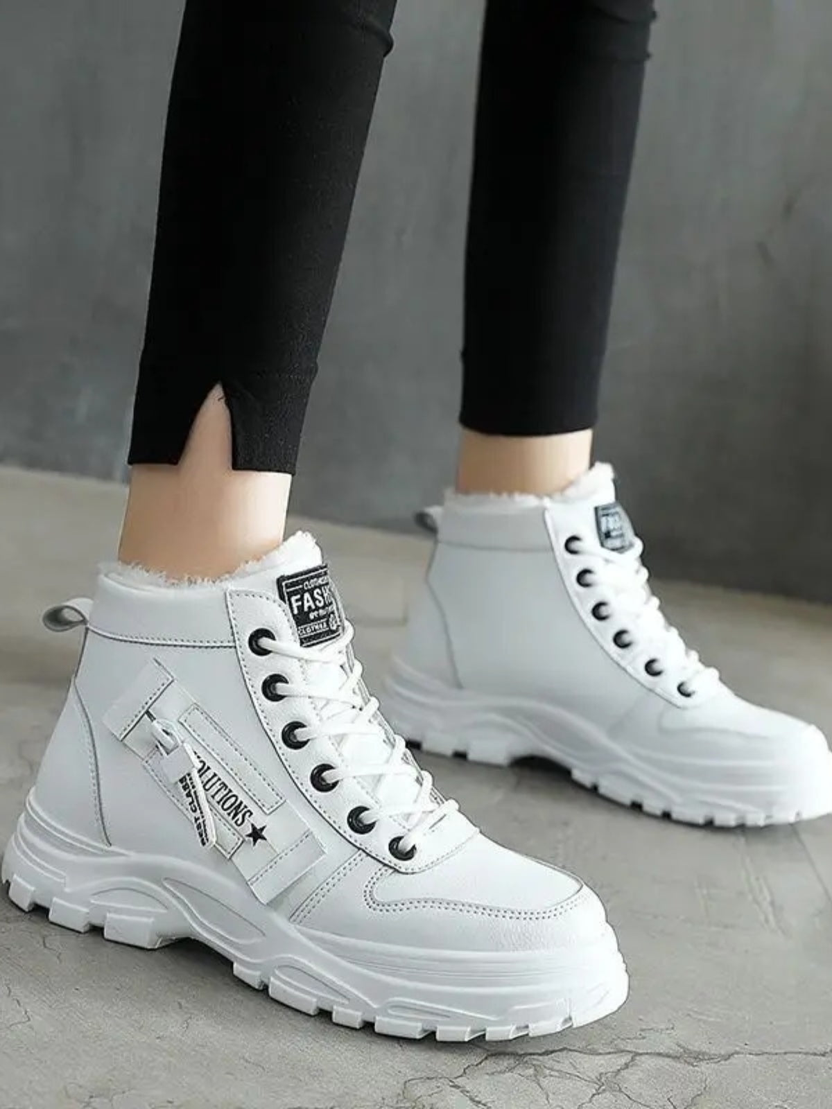  Fashionable Decorative Zipper Round Toe Platform Boots worn with a stylish outfit.