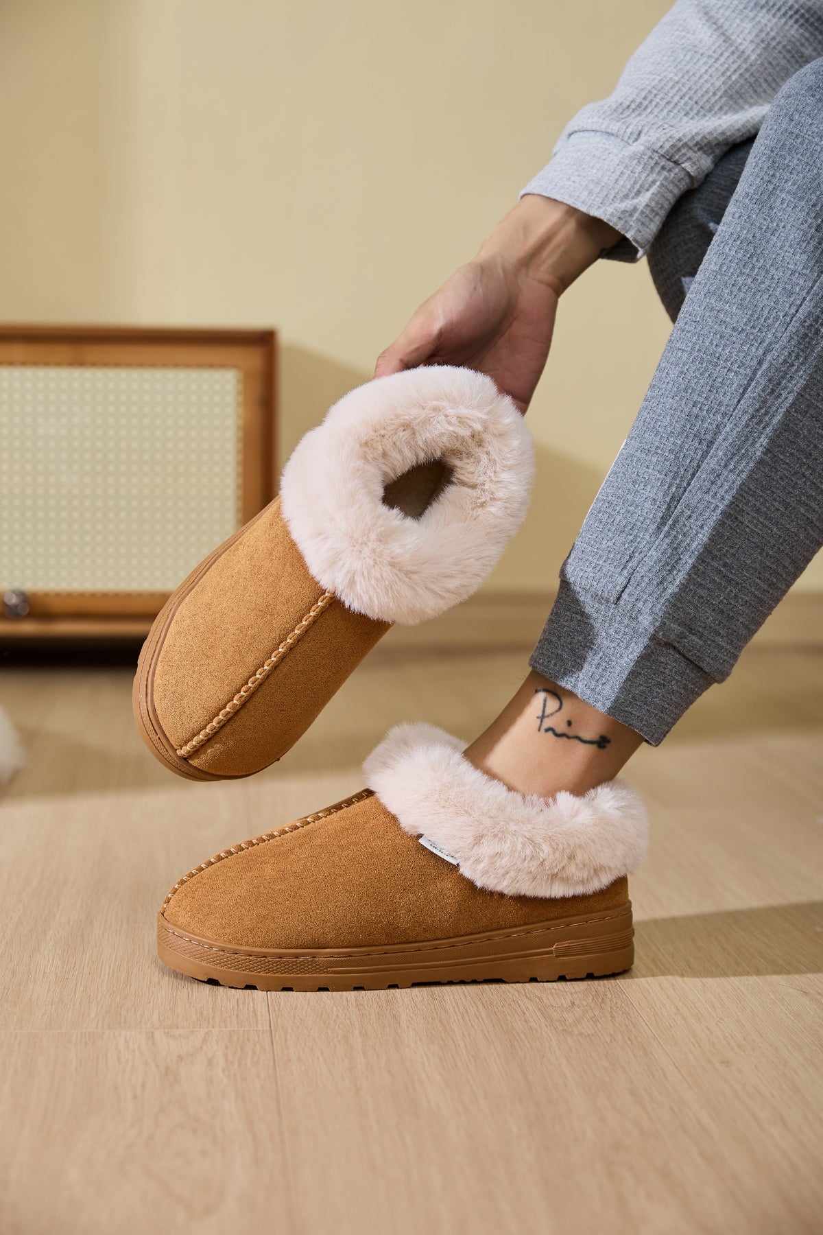 Faux Fur Round Toe Platform Slippers placed on the bedroom floor, perfect for a comfy, relaxed morning.