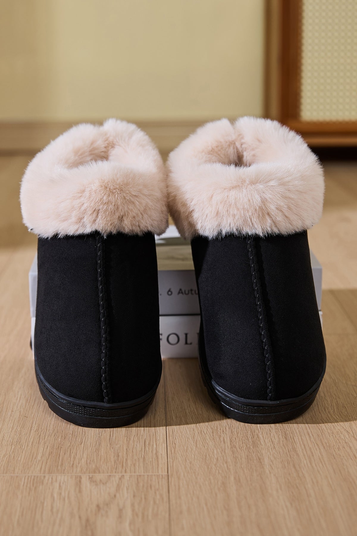 Faux Fur Round Toe Platform Slippers laid on the floor to show off the platform sole and faux fur lining.