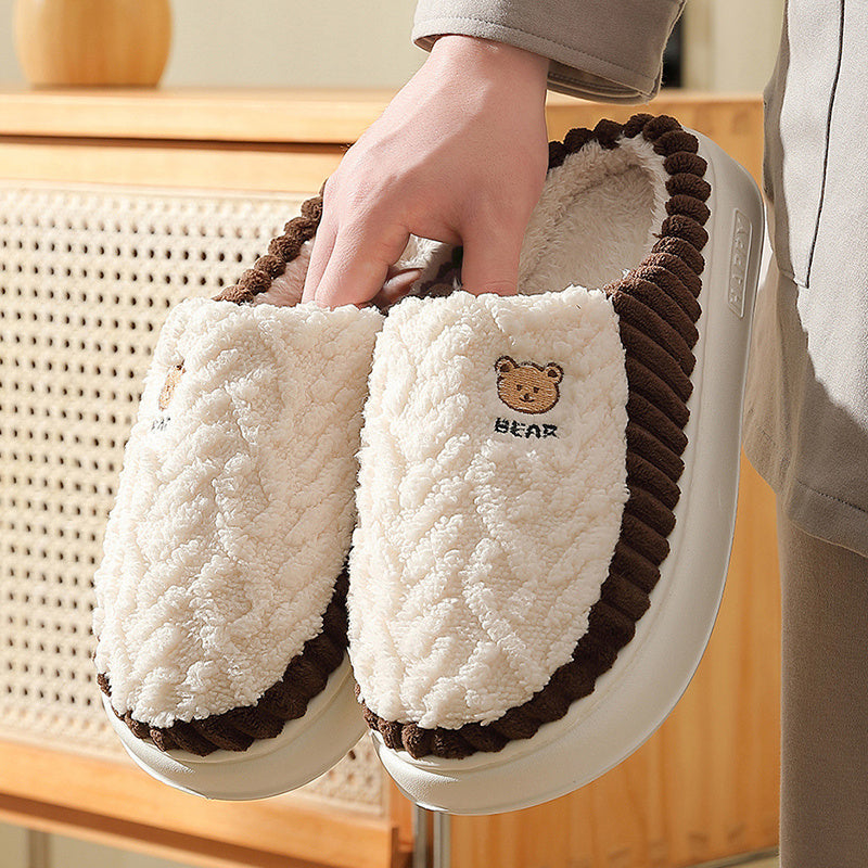 Indoor bear slippers for couples with a comfy fleece lining for warmth.