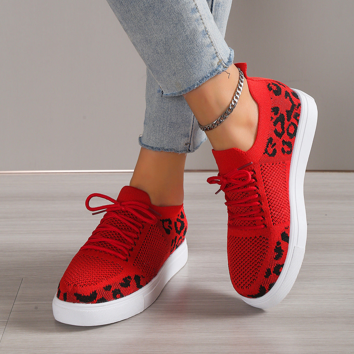 Lace-Up Leopard Flat Sneakers styled for a bold and fashion-forward look, with a fierce leopard print design.