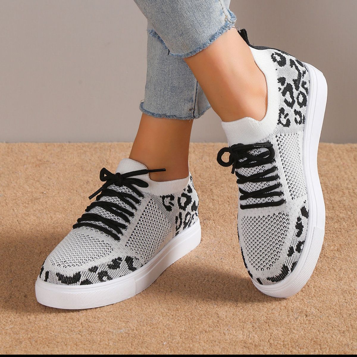 Lace-Up Leopard Flat Sneakers styled for a bold and fashion-forward look, with a fierce leopard print design.