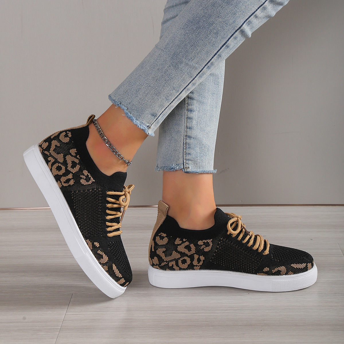 Side view of Lace-Up Leopard Flat Sneakers, showcasing the sleek flat sole and trendy leopard print.