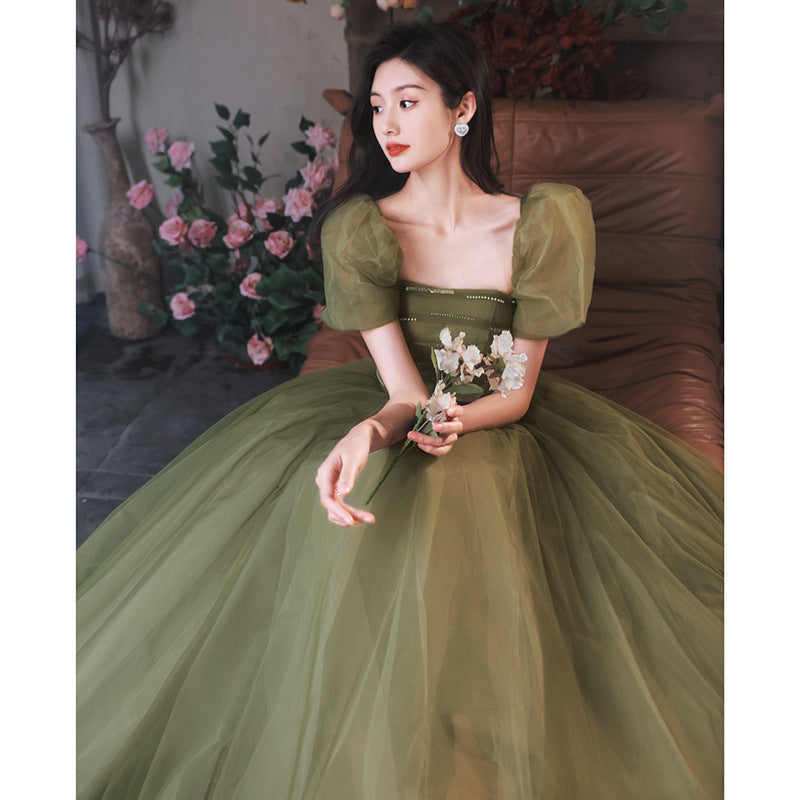 Model Wearing Mori Style Green Evening Dress – Sophisticated and Stylish