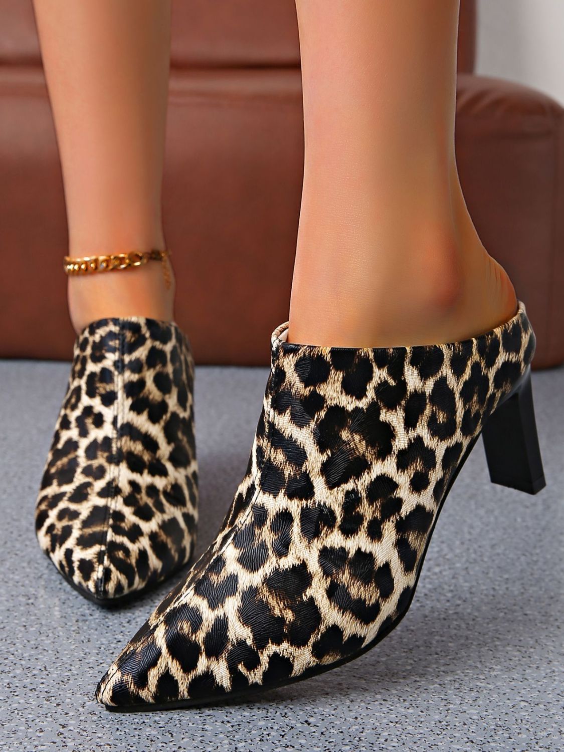 Fashionable PU Leather Leopard Point Toe Pumps styled with a chic outfit for any occasion.