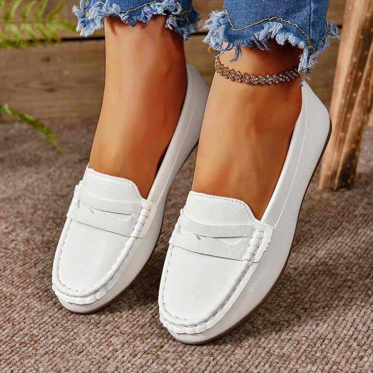 A pair of PU Leather Round Toe Flat Slip-Ons, designed for everyday wear with style.