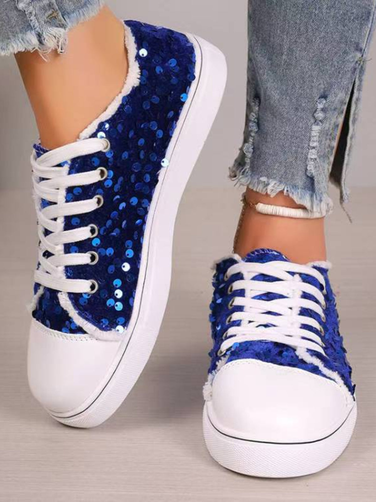 Close-up of the sequins on Sequin Round Toe Flat Sneakers, adding sparkle to every step.