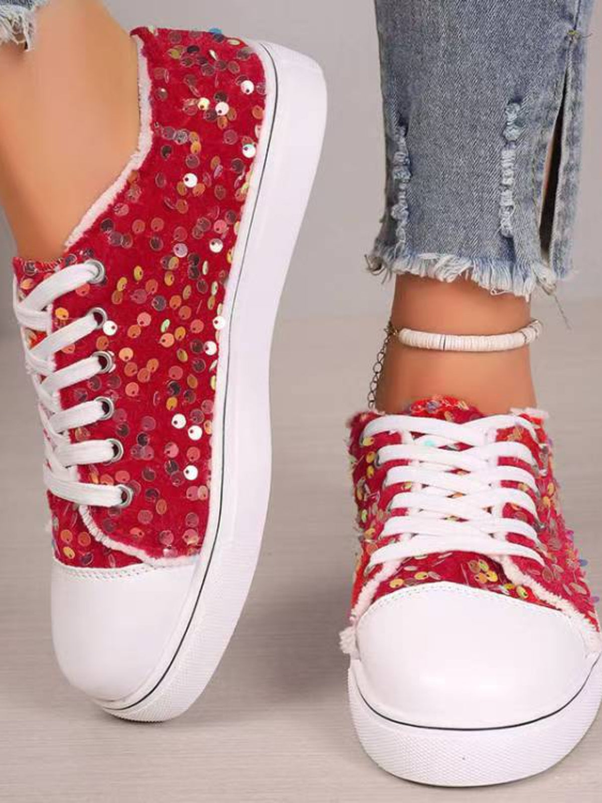 A pair of Sequin Round Toe Flat Sneakers with eye-catching sequins for a chic, casual style.