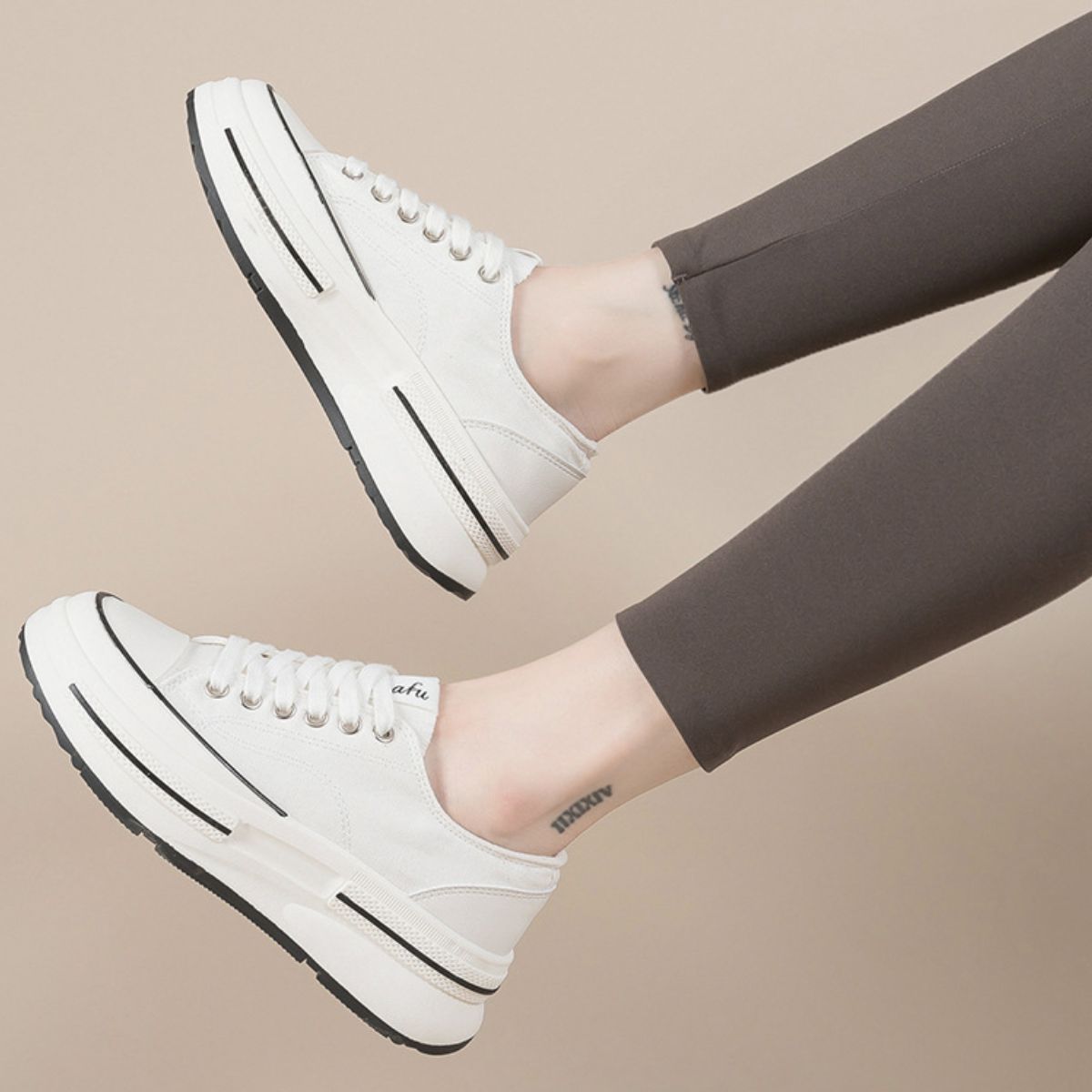 Tied Round Toe Platform Sneakers paired with jeans for a stylish, casual look.