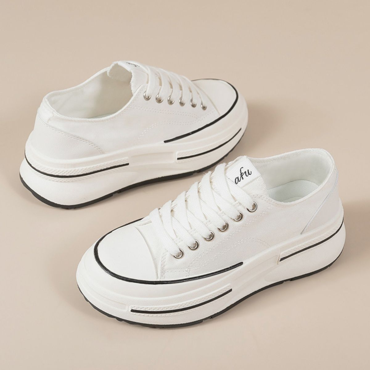 A pair of Tied Round Toe Platform Sneakers, perfect for casual and everyday wear.