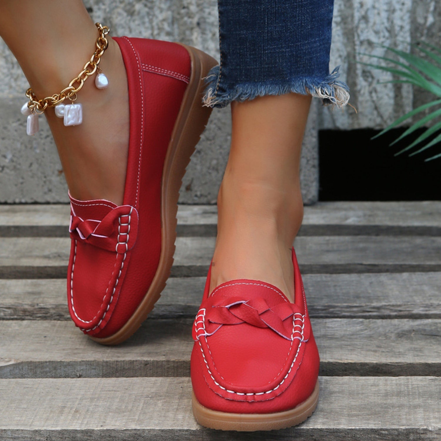 A pair of Weave Wedge Heeled Loafers basking in the sunlight, perfect for outdoor events.