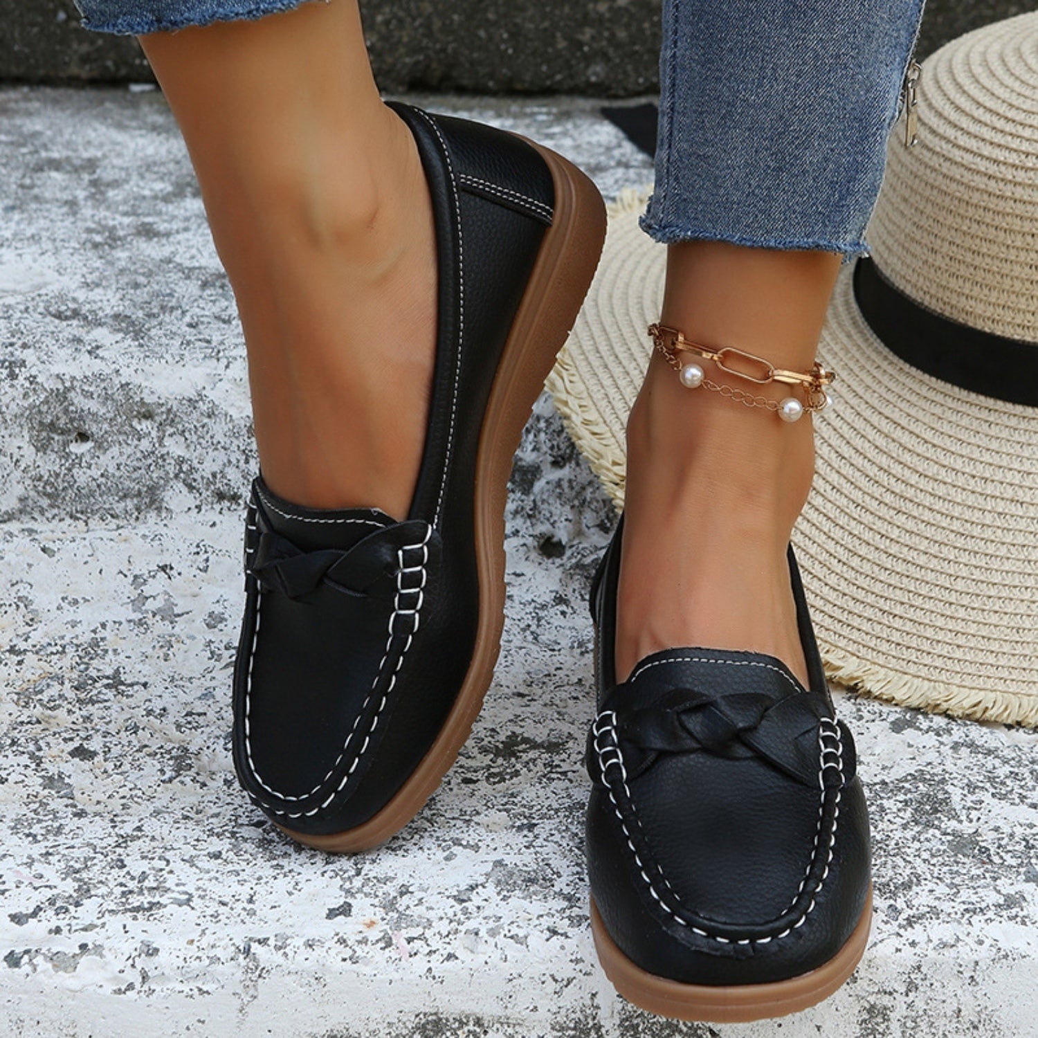 A pair of Weave Wedge Heeled Loafers with a chic and sophisticated design.