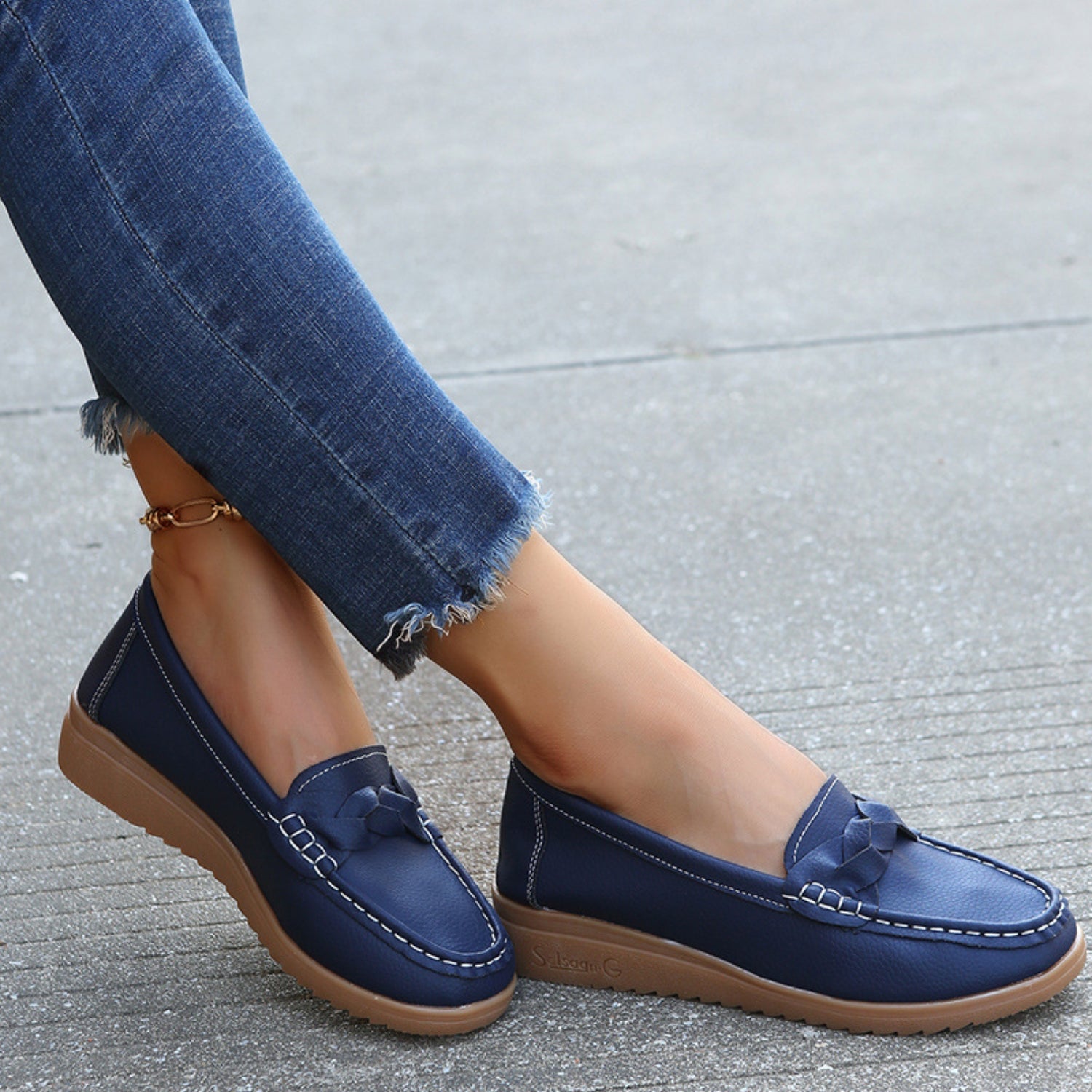 Weave Wedge Heeled Loafers illuminated by sunlight, showing off the chic woven details.