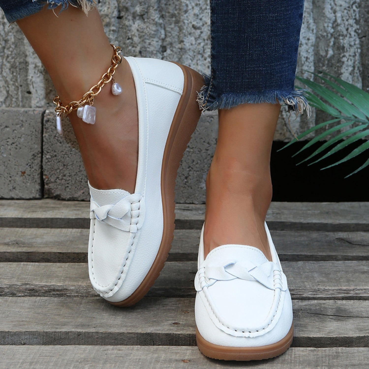 eave Wedge Heeled Loafers worn on stairs, highlighting both style and comfort in action.