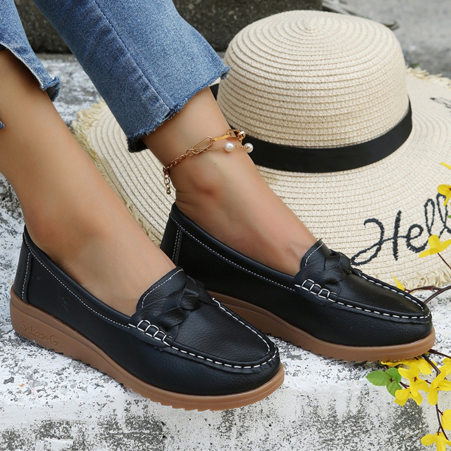 Weave Wedge Heeled Loafers worn with jeans for a chic, casual look.